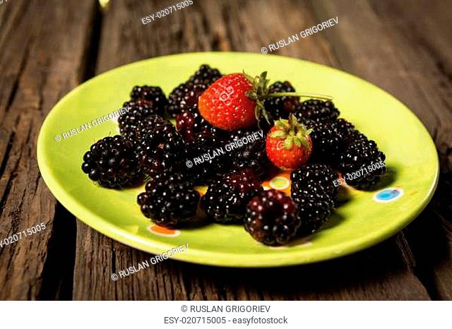 Collection of wild berries and strawberry