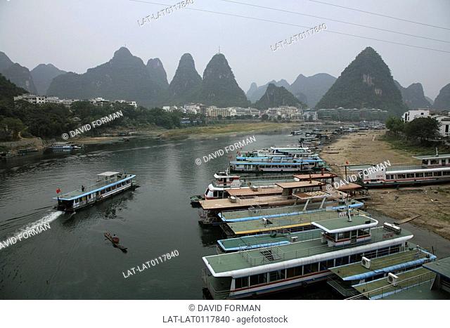The scenery around Guilin and the River Li is dominated by triangular karsts or limestone conical peaks rising from the plain