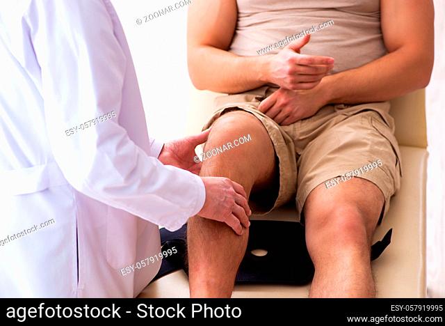 Young man visiting experienced doctor in hospital