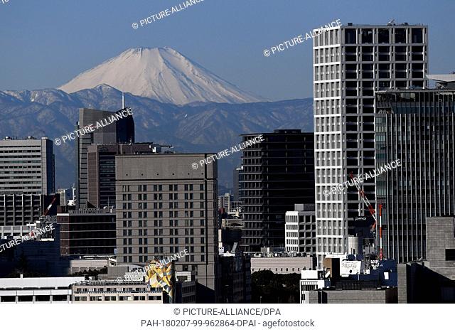 Picture of Mount Fuji seen between Tokyo's skyscrapers in Japan, 07 January 2018. President Steinmeier will take part, along with other heads of state