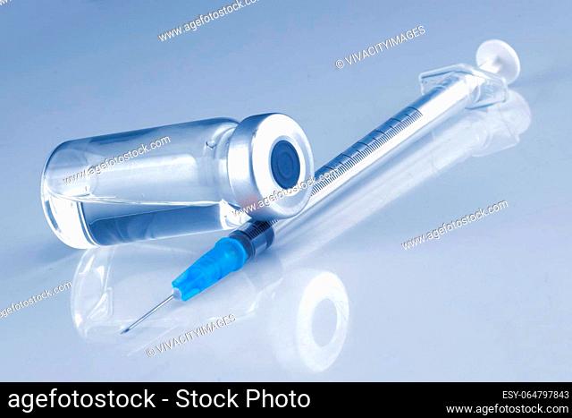 A medical syringe and an ampule bottle for vaccination
