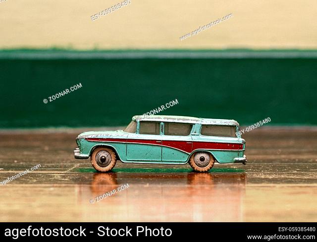 old tin toy car on old wooden floor