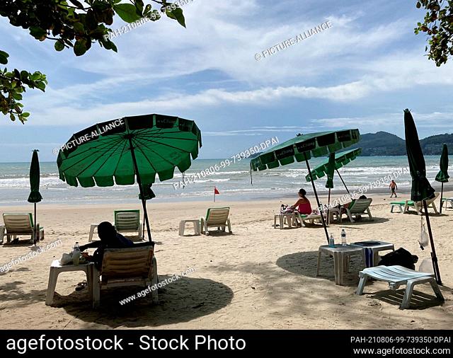 06 August 2021, Thailand, Phuket: Tourists stay at Patong Beach as part of the model project ""Sandbox"". Phuket has been letting fully vaccinated holidaymakers...