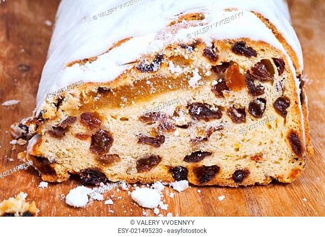 sliced Stollen cake with dried fruit and marzipan