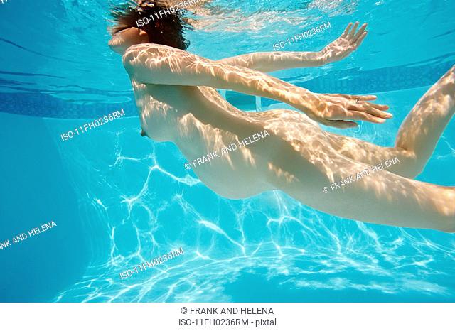 Pregnant woman swimming in pool