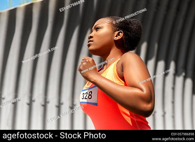 young african american woman running marathon