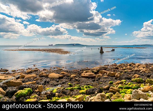 Clouds over the Wreck of The Minx, Osmington Bay, with the Isle of Portland in the background, near Weymouth, Jurassic Coast, Dorset, UK
