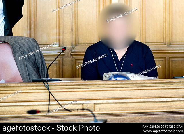 26 August 2022, Bremen: The defendant sits in a courtroom at the Bremen Regional Court. The accused man is accused of drugging his wife in Bremerhaven in...