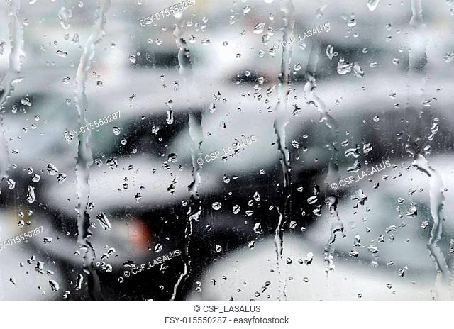Abstract Image: Waterdrops After Snowfall at the Car Window