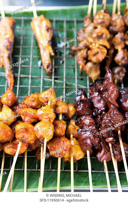 Various satay kebabs at a cookshop stand (Thailand, Asia)