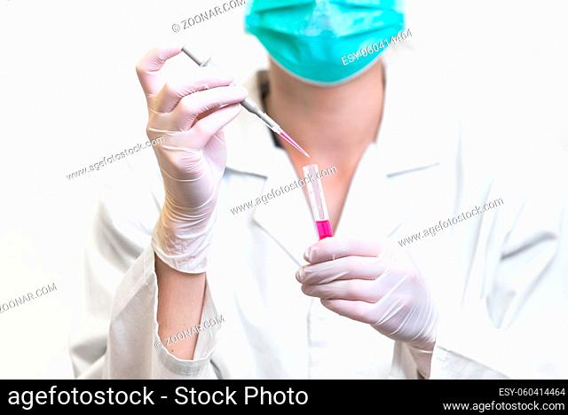Nurse holding test tube with Positive Coronavirus test blood sample. 2019-nCoV pandemic, Novel Chinese Coronavirus, Wuhan Coronavirus blood analysis concept
