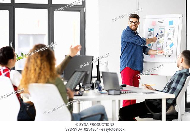 creative man showing user interface at office