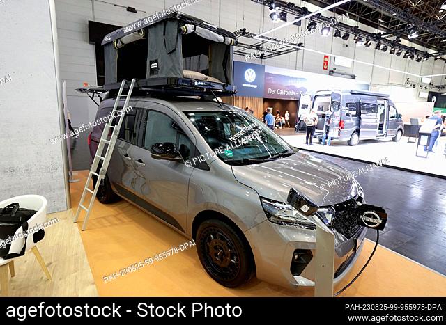 25 August 2023, North Rhine-Westphalia, Duesseldorf: An all-electric Nissan Townstar converted as a camper at the Caravan Fair. Photo: David Young/dpa
