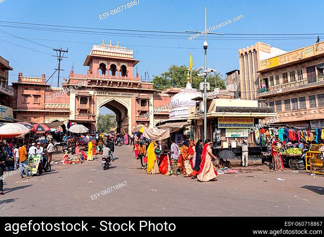 Jodhpur, India - Decembe 8, 2019: People in front of an entry gate to busy Sardar Market