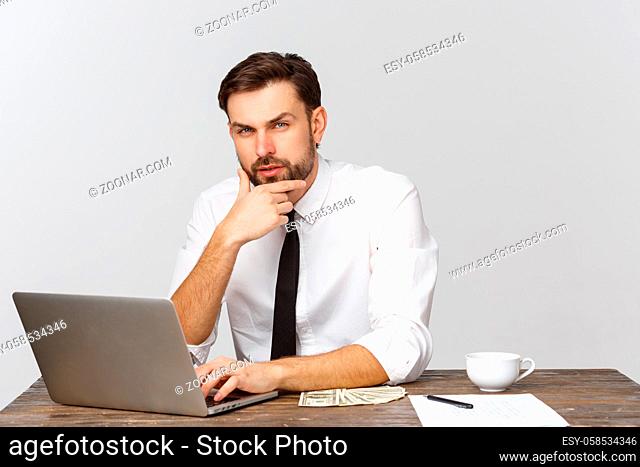 unhappy male working in the office, looking at the camera, front view, isolated on white