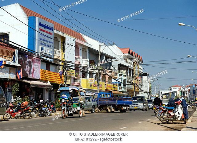 Traffic and shops in the Dongpalan street, Vientiane, Laos, Indochina, Asia