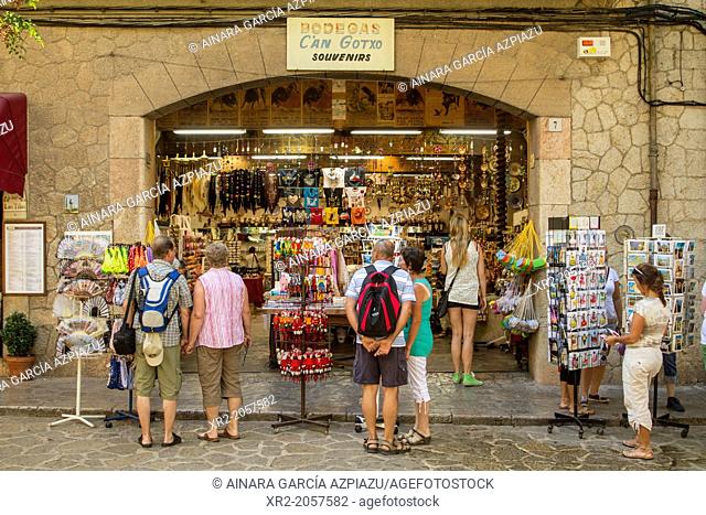 Tourists in a souvenirs shop on the streets of Valldemossa, Mallorca