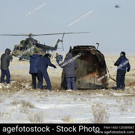 Russian Search and Rescue teams arrive at the Soyuz MS-13 spacecraft shortly after it landed in a remote area near the town of Zhezkazgan