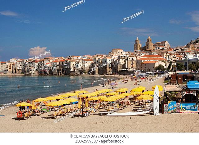 Scene from the the beach with the houses of the town and the Cathedral at the background, Cefalu, Sicily, Italy, Europe