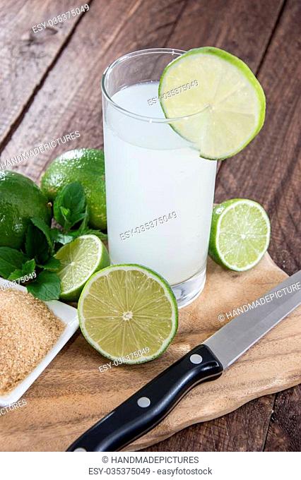 Fresh Lime Juice on wooden background