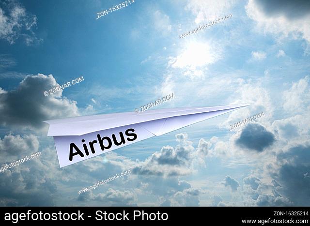 A paper airplane in the sky with the word Airbus