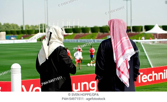 Men dressed in local traditional garb are seen during a training in Doha, Qatar, 13 January 2015. Bayern Munich stays in Qatar until 17 January 2015 to prepare...