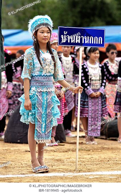 Young Hmong women, traditionally dressed, take part in a new year festival parade at Hung Saew village, Chiang Mai, Thailand, Asia