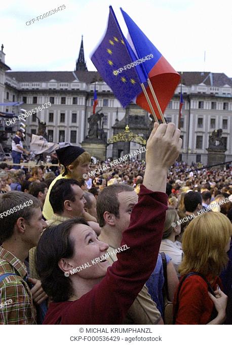 A girl waves with EU and Czech, right, flags during a concert at Prague Castle organized by supporters of Czech Republic's European Union membership on the...