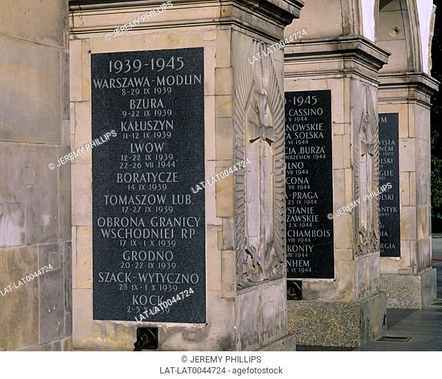 Inscriptions on black slate cover the columns of the Tomb of the Unknown Soldier in Plac Pilsudskiego. These commemorate the fallen of the Two World Wars of the...