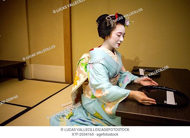 'maiko' (geisha apprentice)working in a tea house.Geisha's distric of Pontocho.Kyoto. Kansai, Japan