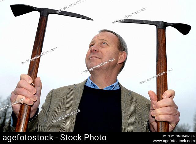 Nick Bowkett, Director/Auctioneer at Stroud Auction Rooms in Gloucestershire, with ice axes used by Theodore Howard Somervell, OBE, FRCS (British 1890-1975)