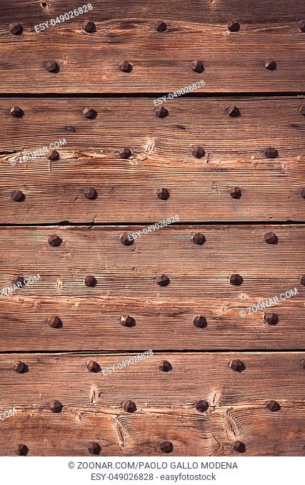Detail of a 200 years old Italian door, made of wood. Background use