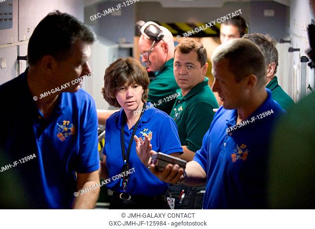 European Space Agency (ESA) astronaut Paolo Nespoli (left foreground) and NASA astronaut Catherine Coleman, both Expedition 2627 flight engineers; Russian...