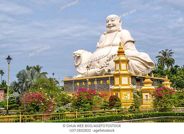 Vietnam, My Tho, Mekong Delta river area. Vinh Trang Pagoda complex, Big Happy Buddha statue (Nam Mo duong Lai Di Lac ton Phat)