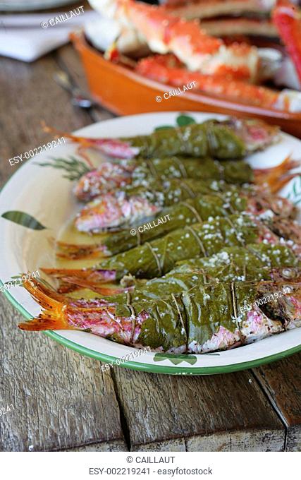 Red mullets wrapped in vine leaves and sprinkled with coarse salt