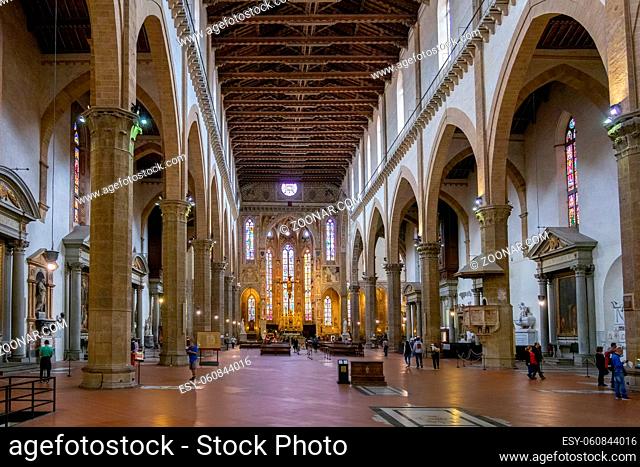 FLORENCE, TUSCANY/ITALY - OCTOBER 19 : Interior view of Santa Croce Church in Florence on October 19, 2019. Unidentified people