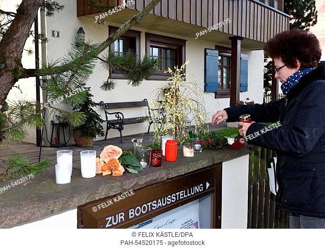 Herta Sprenger, a fan of Udo Juergens from the neighboring village, puts down flowers and lights a candle in front of the house of the late singer and composer...