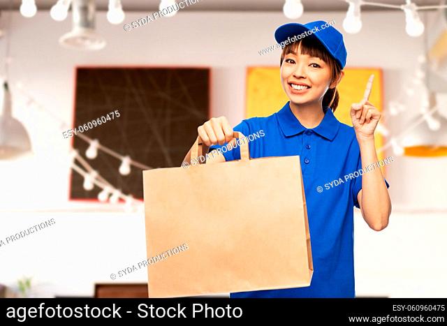 delivery woman with takeaway food in paper bag