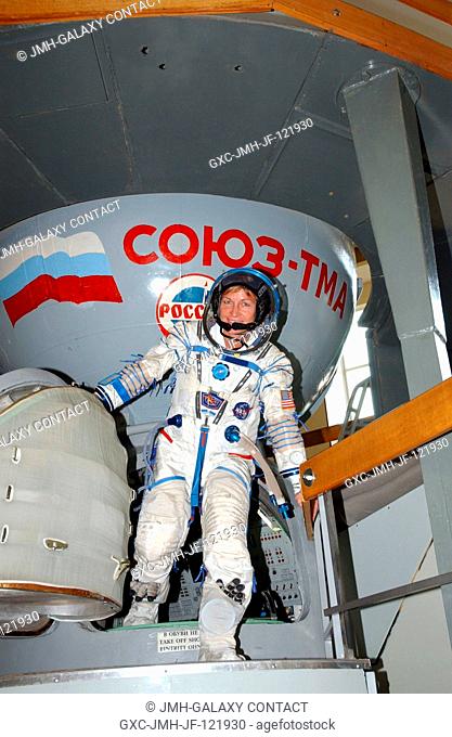 Attired in a training version of the Russian Sokol launch and entry suit, astronaut Peggy A. Whitson, Expedition 16 commander