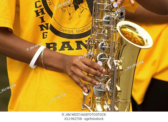 Detroit, Michigan - A girl plays the saxophone in the Martin Luther King High School marching band at the Michigan State Fair