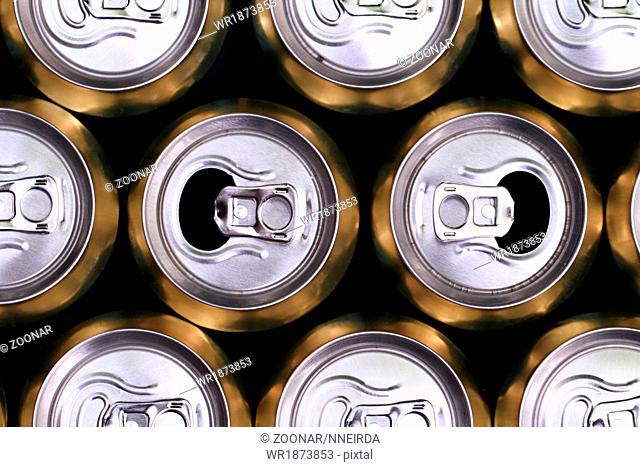 Much of yellow drinking cans close up
