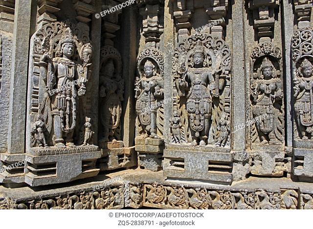 Detailed stone carving, wall relief, deity sculptures at Chennakesava Temple, Hoysala Architecture, Somanathapur, Karnataka, India