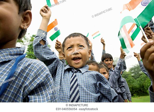 School boys holding the Indian flag