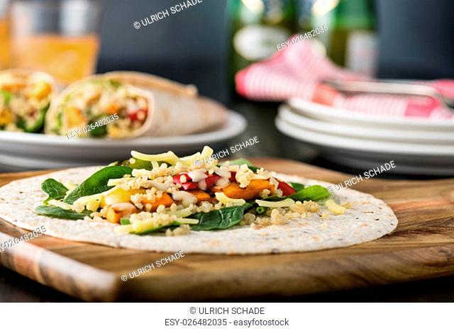 Grilled vegetables wraps with quinoa, pumpkin, peppers and cheese