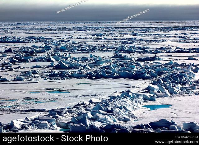 Pack ice near the North pole, hummocky polar ice. Polar day at the lowest position of the sun in late June