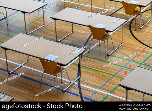 23 April 2021, Saxony, Dresden: Corona quick tests lie on tables in the gymnasium of the St.-Benno-Gymnasium before the start of the Abitur examination in...