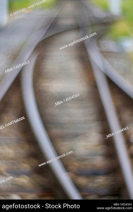 rails of the light rail with a switch, abstract blur