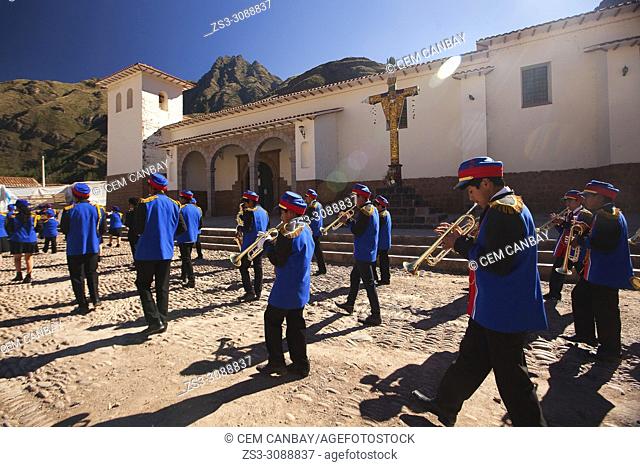 The youth municipal band during a celebration at the town center with the Church at the background, Pisac, Sacred Valley, Cusco Region, Peru, South America