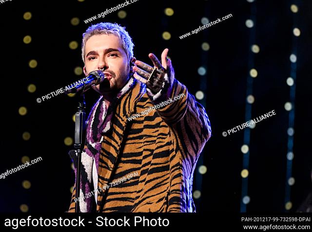 16 December 2020, Saxony-Anhalt, Halle: Bill Kaulitz of the band Tokio Hotel sings on a stage during the radio show ""Friends of 2020"" of the station MDR...