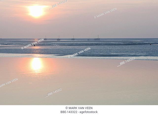 The Wadden Sea between Schiermonnikoog and Lauwersoog at sun set